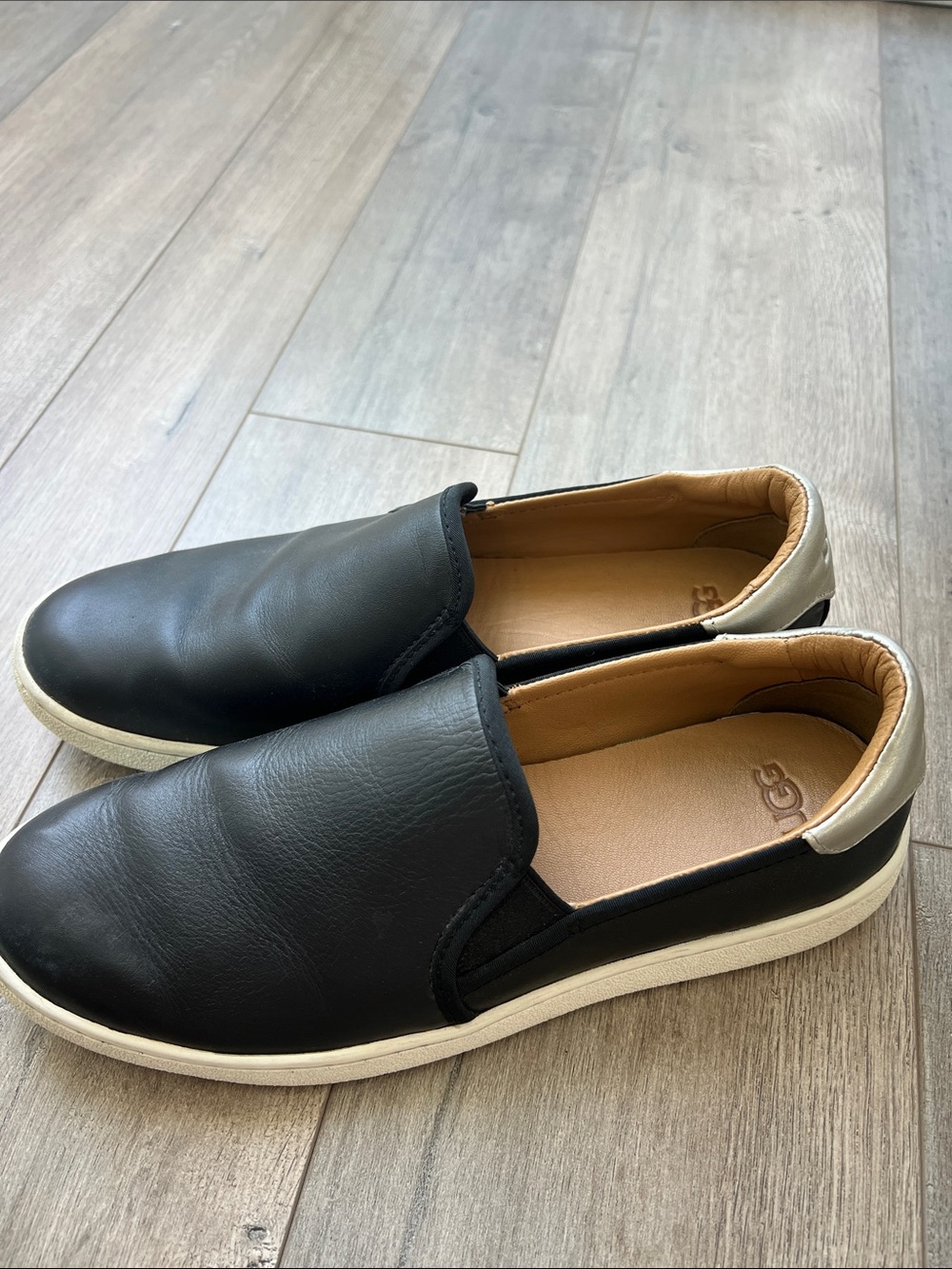 UGG Women’s Black Leather Slip-On Loafers with White Sole Size 9